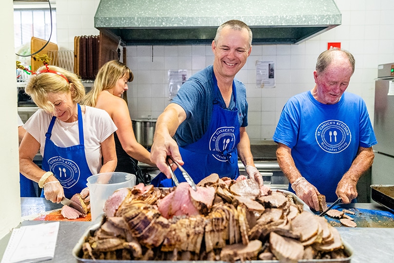 A festive meal is prepared lovingly by dozens of volunteers from St Canice’s Kitchen for hundreds of people who are homeless or struggling with the rising cost of living. Photo: Alphonsus Fok