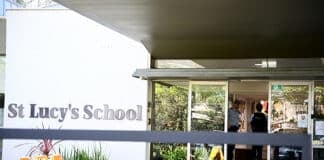 School communities are being urged to rally around students and teachers after a young boy died when he became stuck under a lift. Photo: AAP Image/Dan Himbrechts