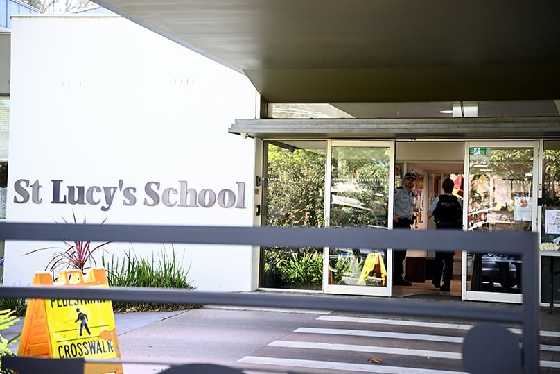 School communities are being urged to rally around students and teachers after a young boy died when he became stuck under a lift. Photo: AAP Image/Dan Himbrechts