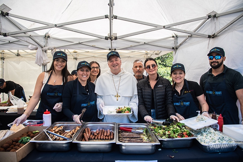 Archbishop Anthony Fisher OP was joined by bishops, priests and supporters who provided food, entertainment and a smile for those most in need. Photo: Giovanni Portelli