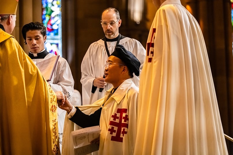 Archbishop Anthony Fisher OP invests James Lu into knighthood at St Mary’s Cathedral on 26 November. Photo: Giovanni Portelli