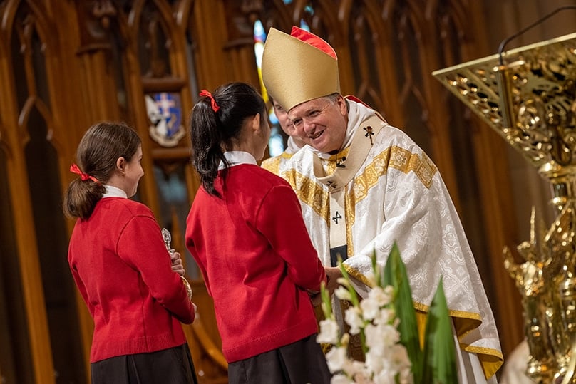Our Lady Help Christians Primary School students with Archbishop Anthony Fisher OP. Photo: Kitty Beale