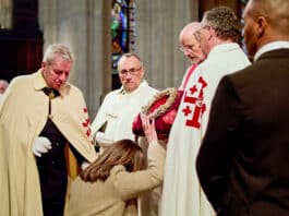 The Crown of Thorns, pictured being venerated during a Good Friday service, would have been destroyed if not for the bravery of many during the Notre Dame Cathedral fire. Photo: Courtesy of Netflix