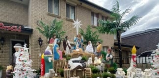 Mariette Ndaira’ proudly displays a Nativity themed Christmas scene in her front yard in the inner west of Sydney. Photo Darren Ally