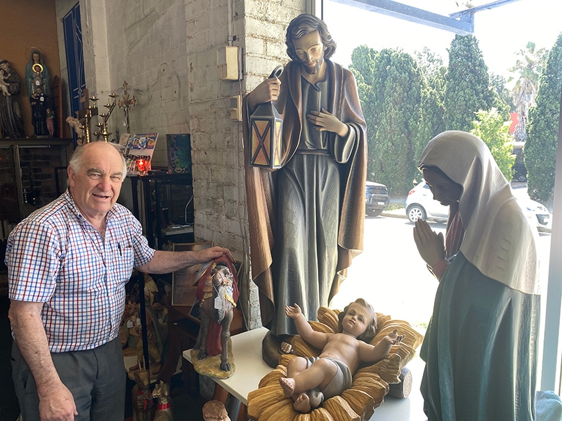 Paul Sarks with his life sized nativity set. Paul has been selling religious supplies for over 62 years. Photo: Darren Ally