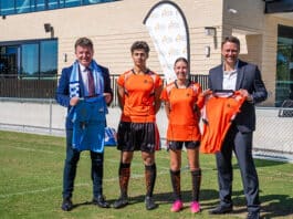 SCS Executive Director Tony Farley, left, and Sydney FC CEO Mark Aubrey with students participating in the football programs. Photo: Supplied