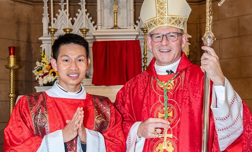 Deacon Hien Vu with Bishop Anthony Randazzo. Photo: Giovanni Portelli