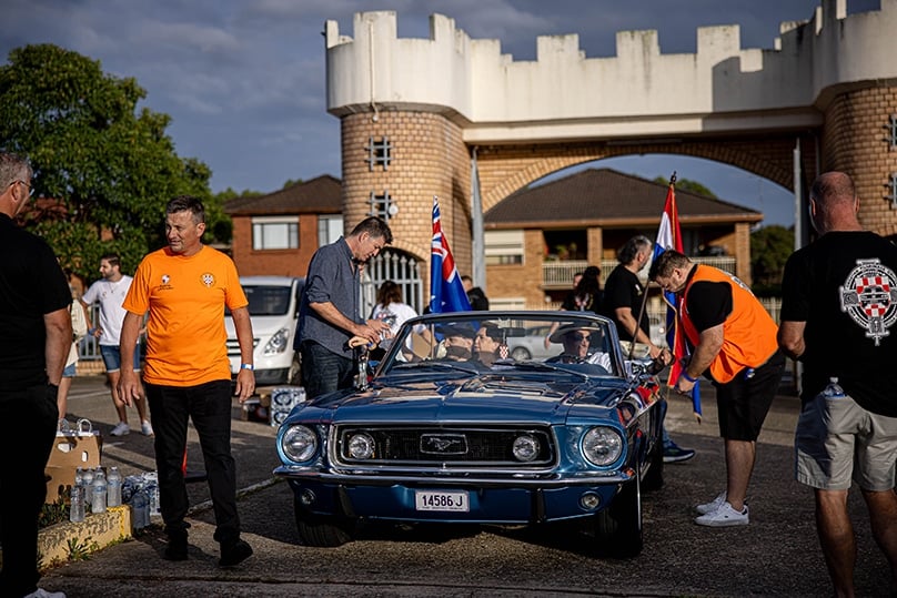 Fr Davor Filco, parish priest at Summer Hill’s Croatian church, celebrated Mass and conducted a pilgrim blessing before over 100 muscle cars and motorbikes set off for Figtree on the second annual Croatian Pilgrimage Cruise. Photo: Alphonsus Fok