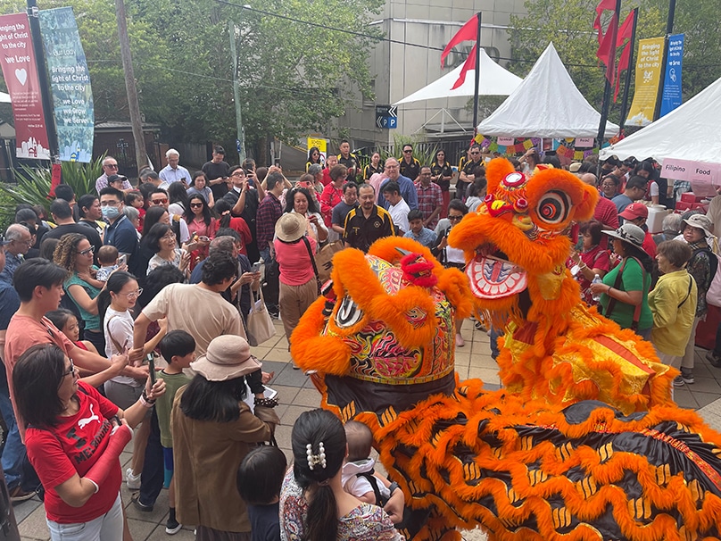Lion dancers make their way through Chatswood forecourt on 11 February. Photo: Supplied