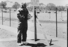 A man wears protective clothing at Maralinga. Photo: Archival/National Museum of Australia