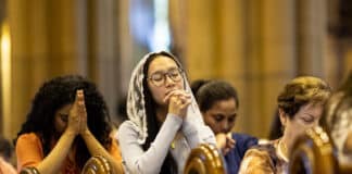 Women flocked to St Mary’s Cathedral to pray, attend confession and catch up. Photo: Alphonsus Fok
