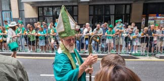 St Patrick greets revellers on Pitt St at the annual parade. Photo: Adam Wesselinsoff
