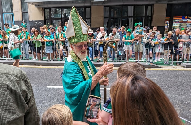 St Patrick greets revellers on Pitt St at the annual parade. Photo: Adam Wesselinsoff