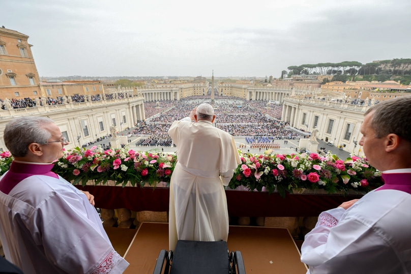 Pope Francis greets the crowd after delivering his Easter message and blessing "urbi et orbi" (to the city and the world) from the central balcony of St. Peter's Basilica at the Vatican March 31, 2024. Photo: CNS photo/Vatican Media