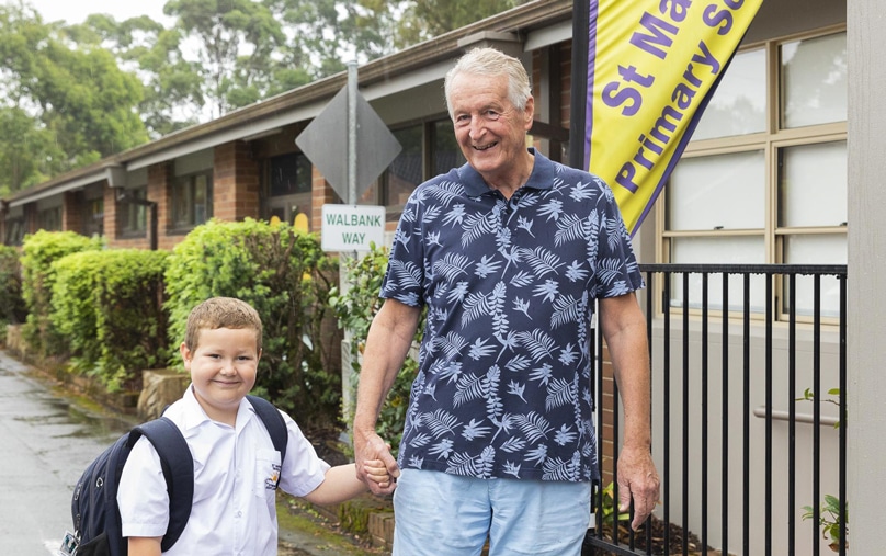 Bill Clark with grandson Leo, one of the first students enrolled under the new model of educating students with disability in Broken Bay. Photo: Diocese of Broken Bay