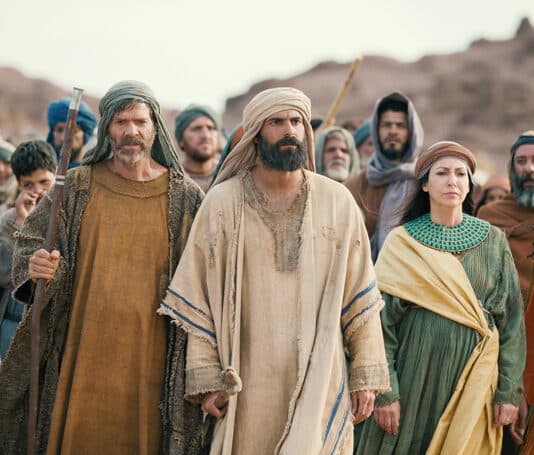 Moses (Avi Azulay) stand between siblings Aaron (Ishai Golan) and Miriam (Reymonde Amsellem) as they walk towards the Red Sea. Photo: Netflix