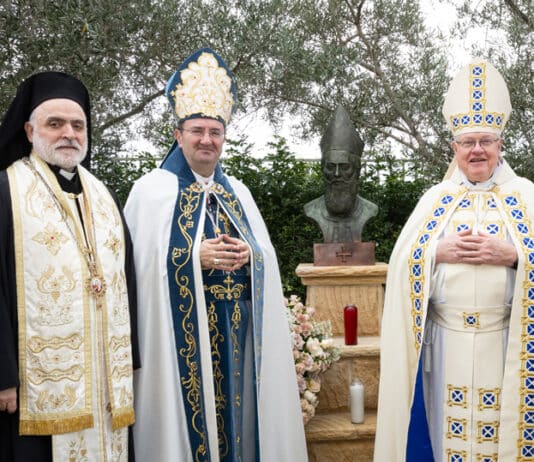 Bishop Antoine-Charbel Tarabay, centre, celebrated the feast of Our Lady of Lebanon and the 320th anniversary of the passing of Venerable Patriarch Estephan El Douaihy at Our Lady of Lebanon Co-Cathedral in Harris Park, with Archbishop Charles Balvo, Apostolic Nuncio to Australia, at right, as well as Bishop Robert Rabbat of the Melkite Catholic Church. Photo: Alfred Boudib/Visualeyes Photography